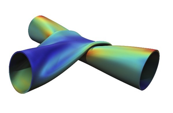 在COMSOL (R) 6.1 版本中使用新方法進(jìn)行接觸分析。仿真結(jié)果顯示了兩個金屬管的應(yīng)力和變形。